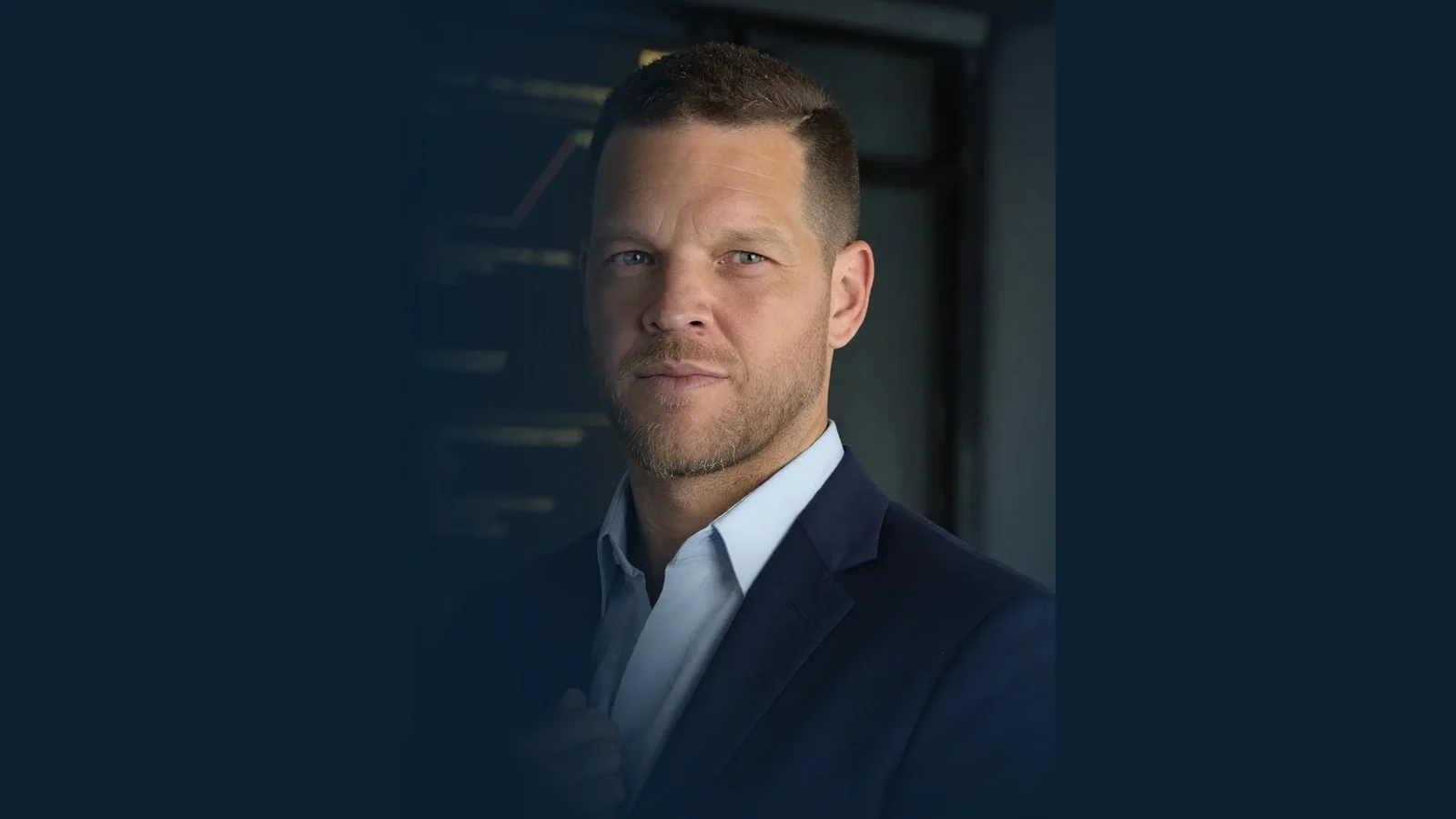 Portrait of Mike Moore, life insurance advisor at Big Sioux Life, on a river navy background
